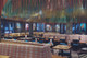Nando's restaurant with upholstered seating in Laguna Orange. Dark walls and Colourful chains hanging from ceiling. Design by Fusion DNA